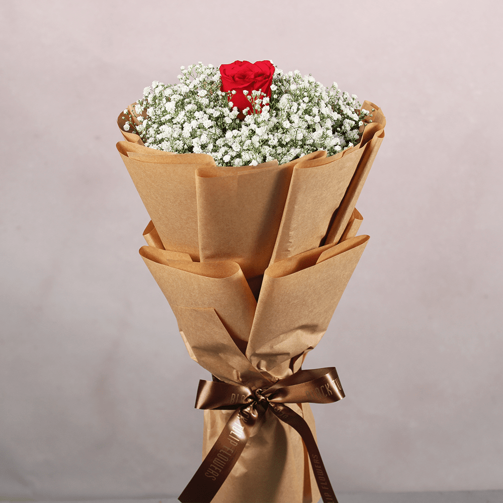 Gypso-Rose-Bouquet Gypso and red rose bouquet wrapped in Kraft brown paper tied with a brown satin ribbon.