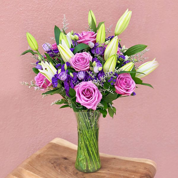 Lavish Pink Roes with Lilly in vase Purple Roses with Lilly in vase | send flowers online delhi | Order Now At JF