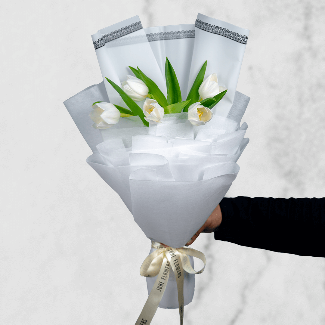 bouquet-white-tulips Stunning white tulip bouquet in a pristine Cellophane white wrapper