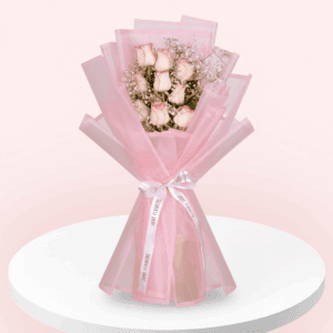 Enjoy this hand-tied 8 pink rose and gypso bouquet wrapped in Korean style flower wrapping sheets with white ribbon