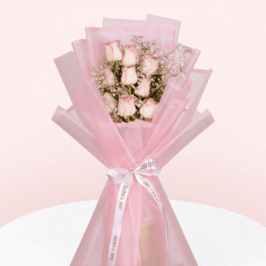 Enjoy this hand-tied 8 pink rose and gypso bouquet wrapped in Korean style flower wrapping sheets with white ribbon