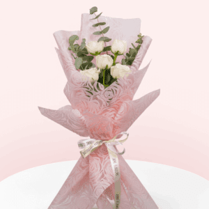 5 white roses handtied in a bouquet with eucalyptus and Korean wrap