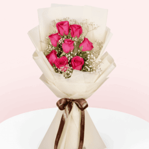 Bouquet of 8 Dark Pink roses and gypso in non-woven pastel cream colour paper wrap with ribbon